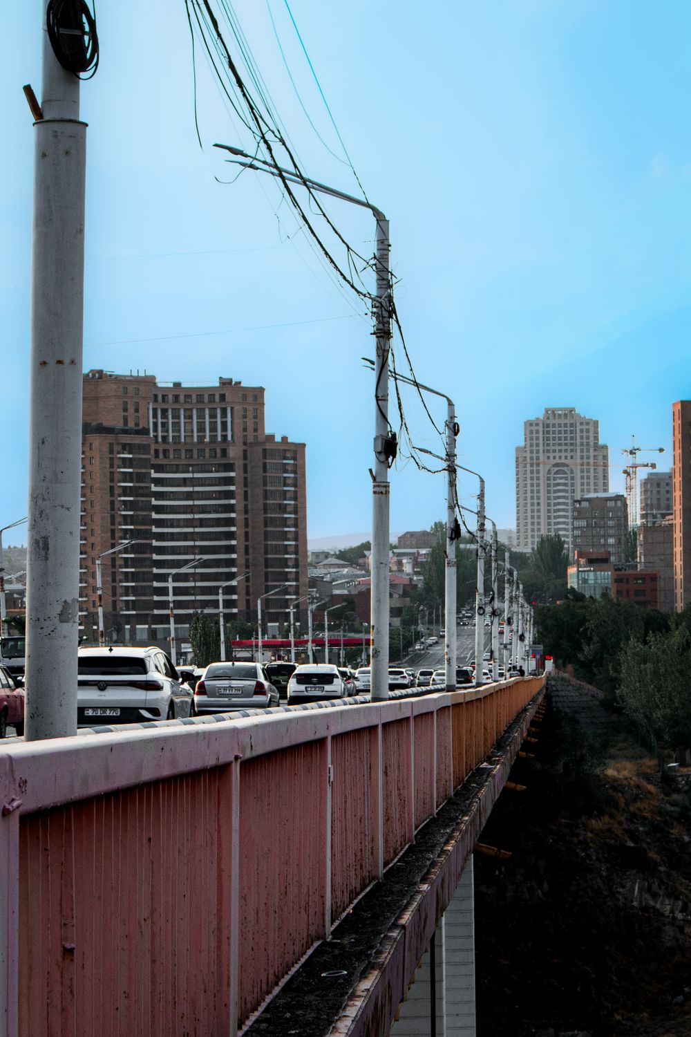 DuPage County Transportation System Under Pressure: Roads, Trails, and Daily Mobility Challenges Across the Region 4 Traffic moves over a bridge in Yerevan, Armenia, capturing urban life and infrastructure.