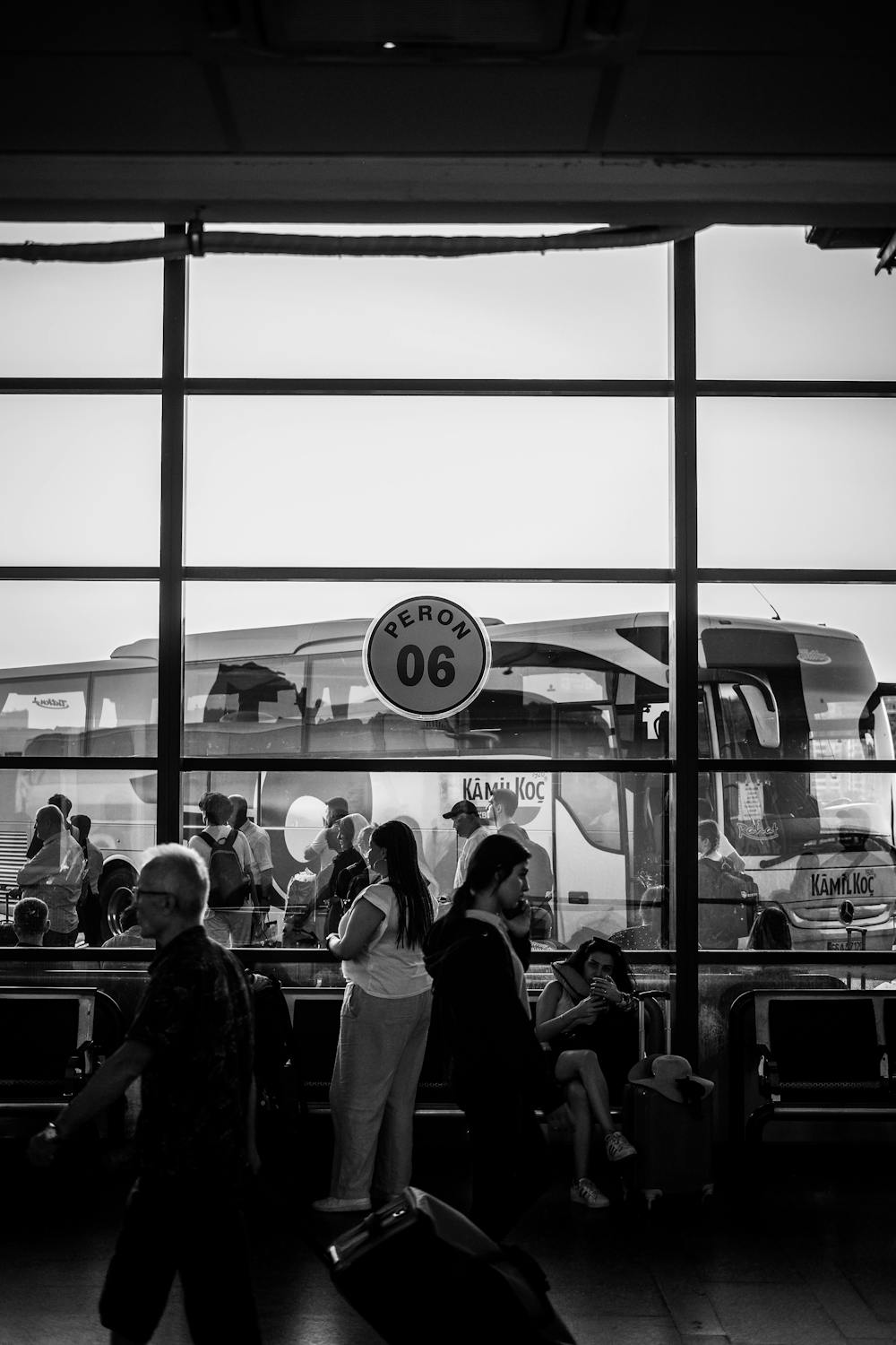 Travelers wait at a bustling bus terminal in Ankara, Türkiye.