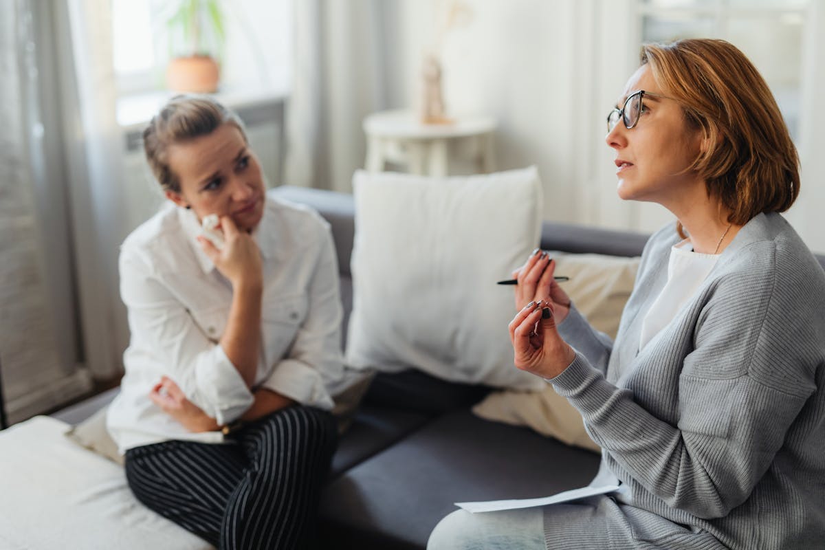 11 Most Useless and Misused Pieces of Common Advice 5 Two women engaged in a thoughtful counseling session in a cozy indoor setting. advice