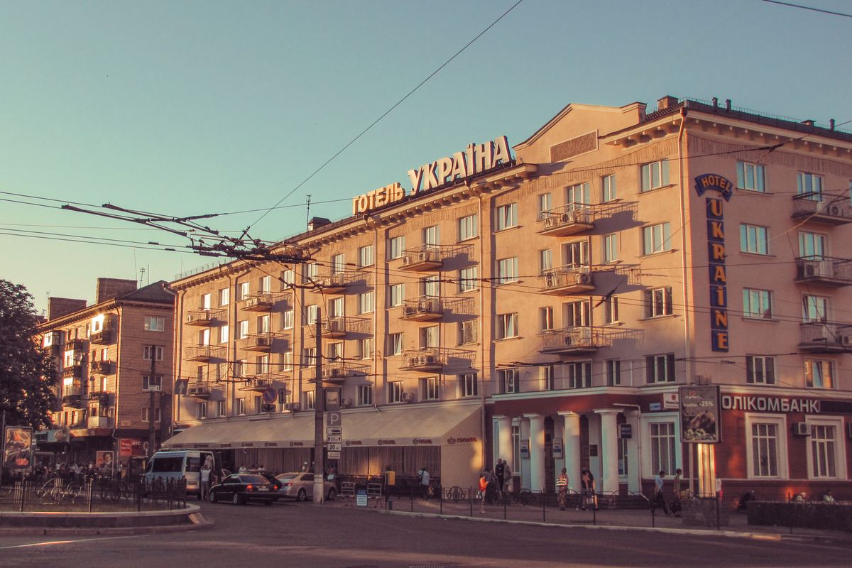 View of the historic Hotel Ukraine in Chernihiv, captured during a warm day.