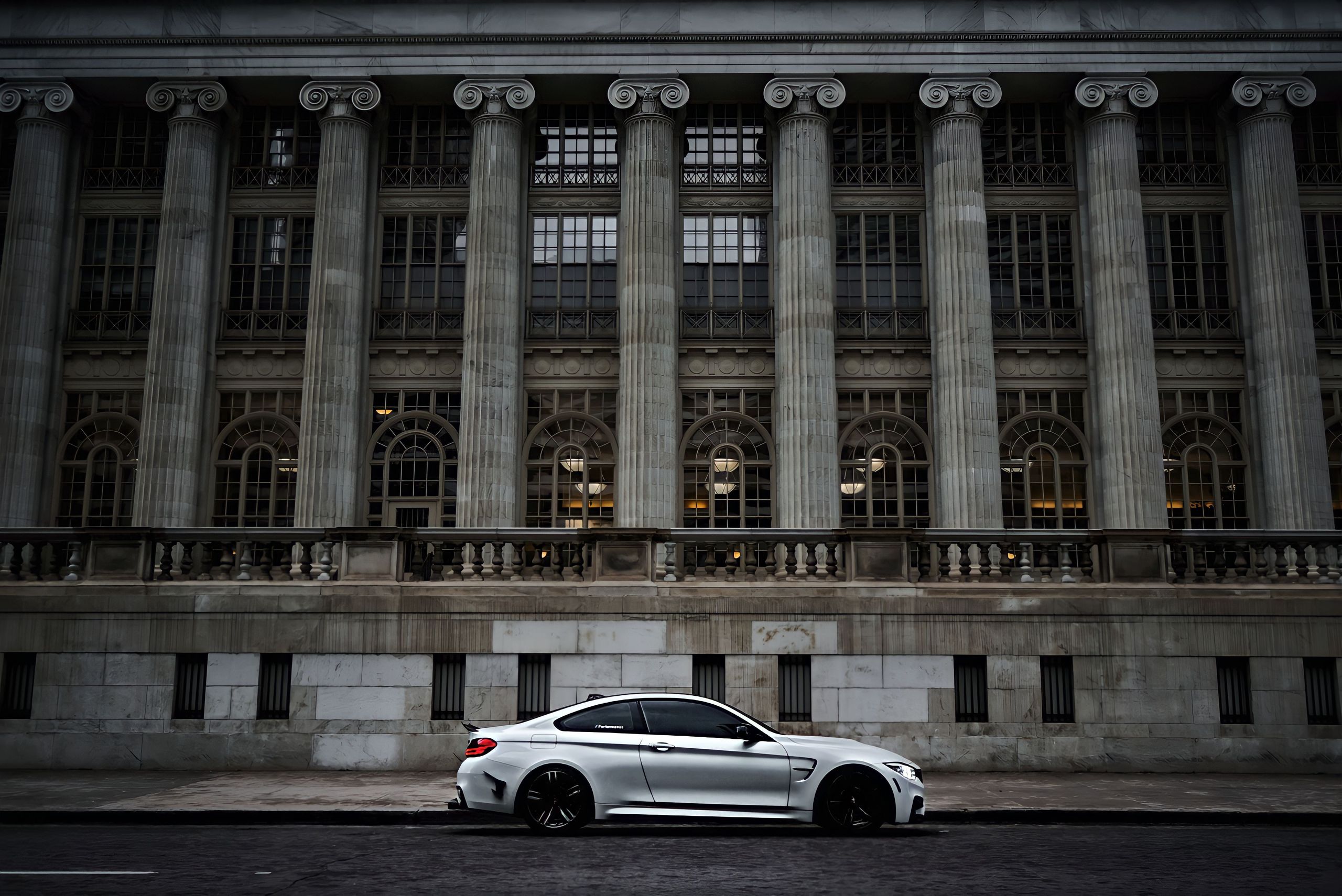 A $109K Claim, a Rolls-Royce Dispute, and Randolph County’s Hospital Trust Problem 1 White car parked in front of a historic neoclassical building with ornate columns.