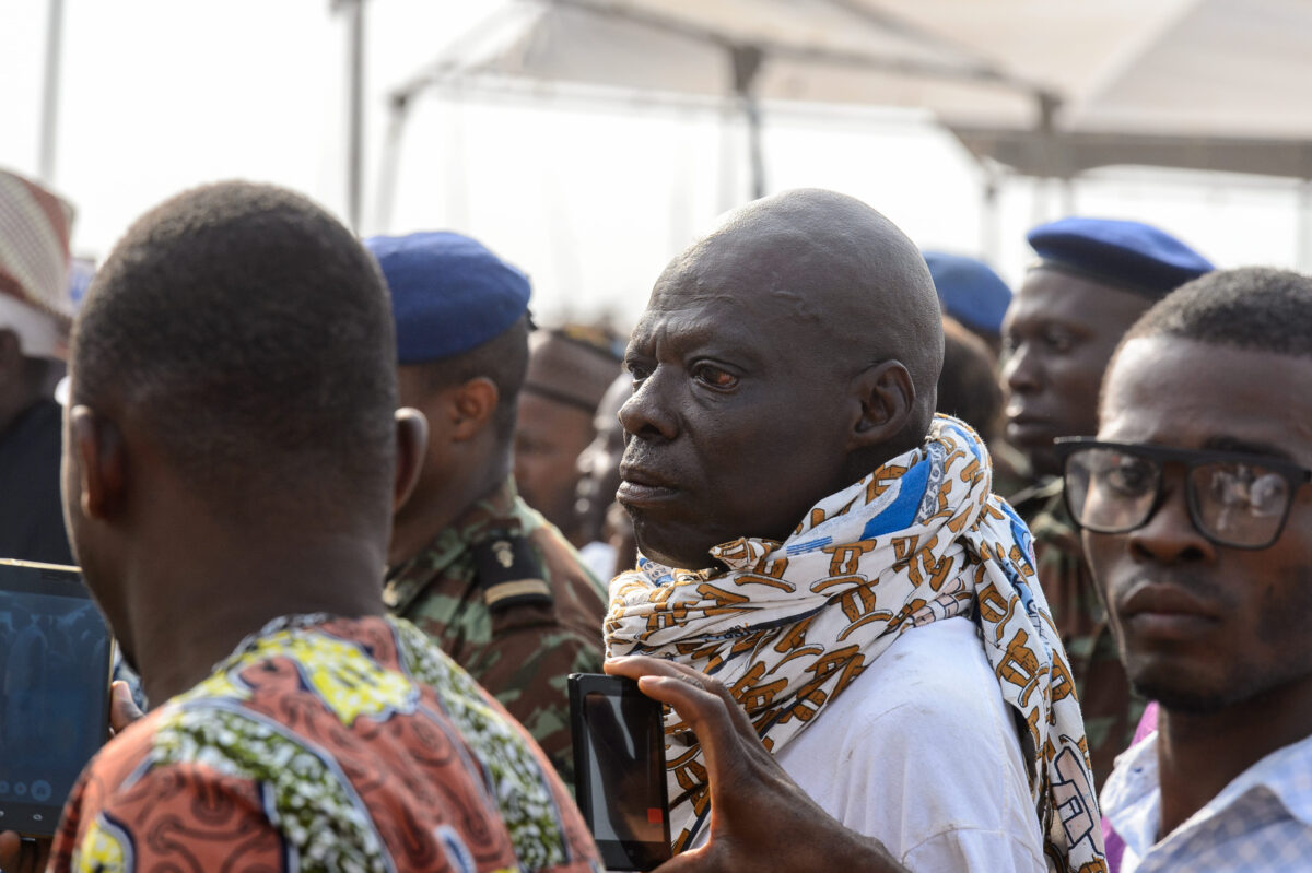 Traoré Draws a Firm Line on Religious Extremism and Demands Skills That Can Build Burkina Faso 3 OUIDAH, BENIN - Jan 10, 2017: Unidentified Beninese men from behind at the voodoo festival, which is anually celebrated on January, 10th.