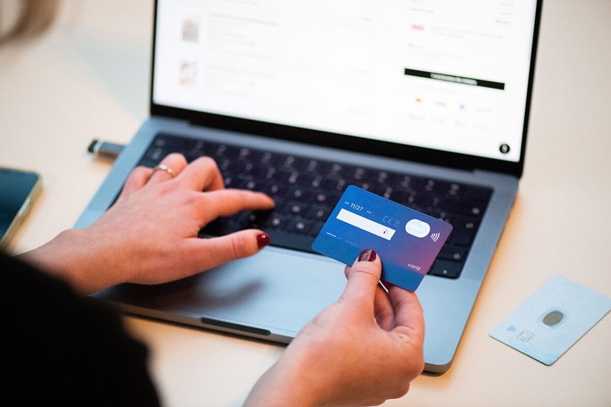 In America’s Retail Crime Battle, E-Commerce Has Become Both the Battlefield and the Weapon. 3 A person using a bank card to shop online