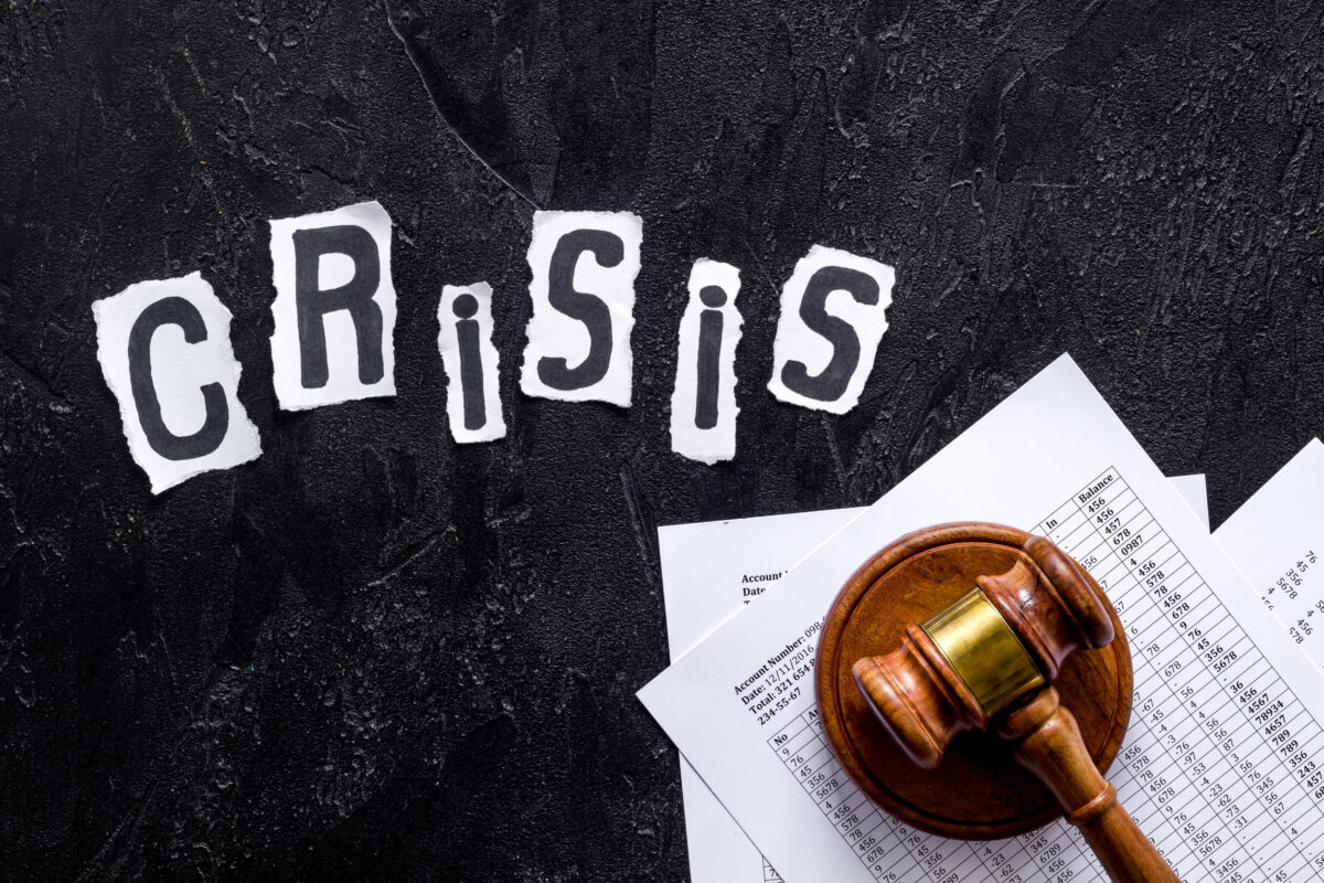 Court Filing Says Politics Chose the Targets in Trump’s $7.6 Billion Clean Energy Cuts 2 Debt in crisis - judge hammer - on black desk top-down