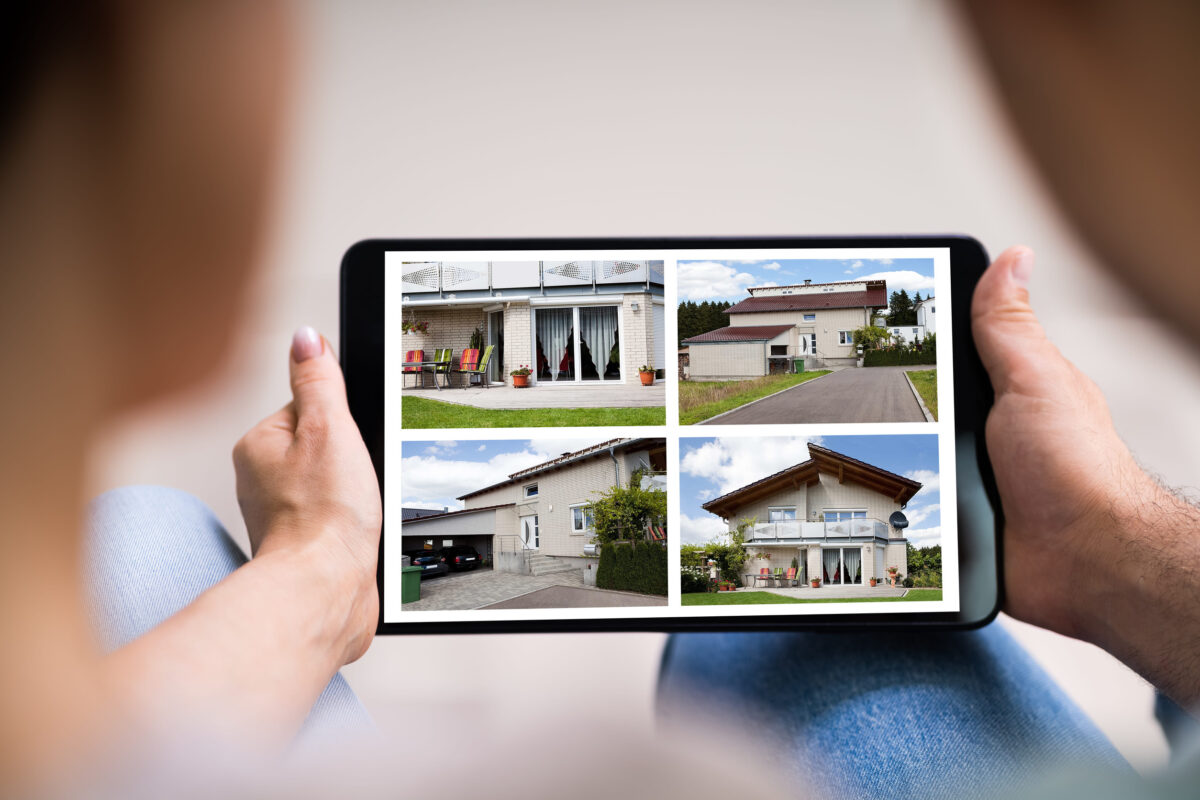 Canadians Are Trading Homes Instead of Booking Hotels as Travel Costs Keep Rising 2 Couple Family Searching Real Estate Online On Tablet