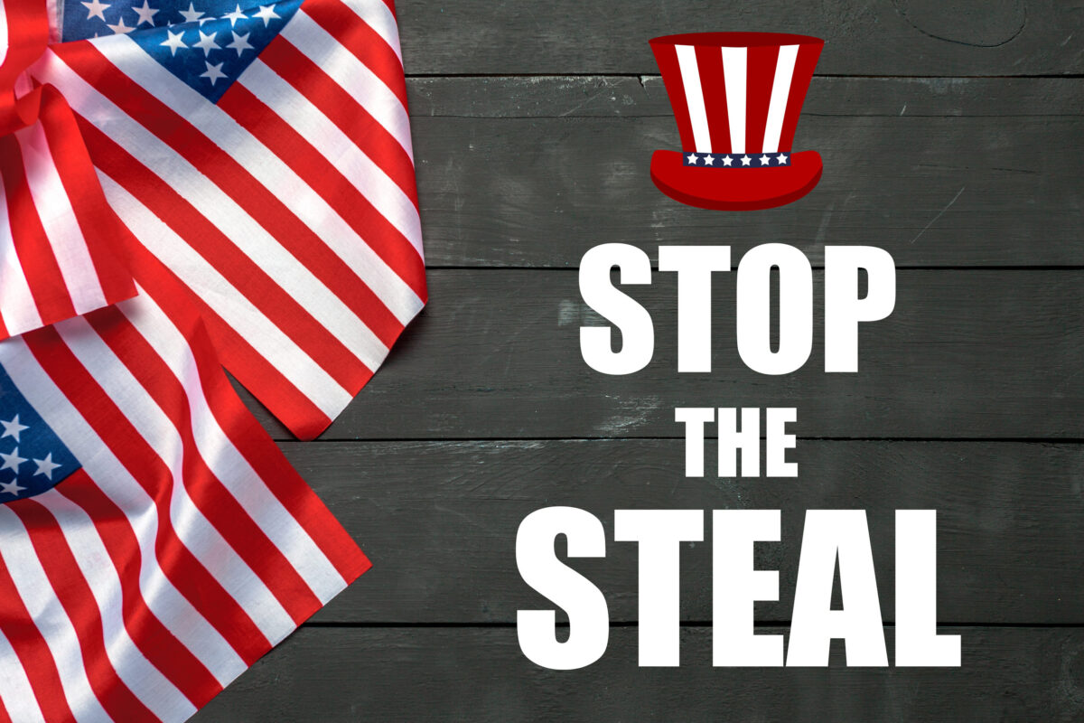 American flags on wooden board. Stop the steal