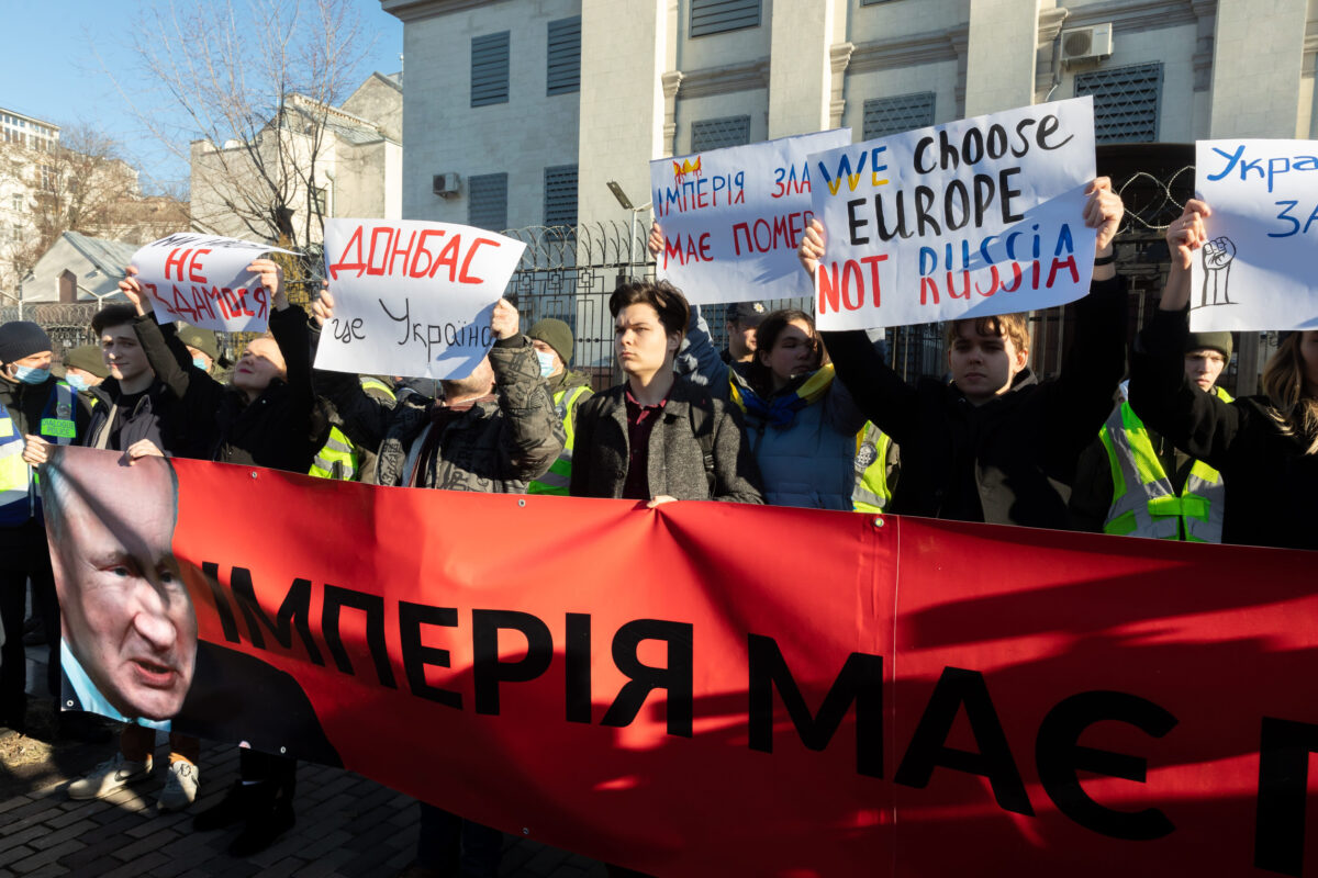 KYIV, UKRAINE - Feb. 22, 2022: The empire must die. Protest action near the Embassy of the Russian Federation in Kiev. Text - Empire must die and Donbas is Ukraine