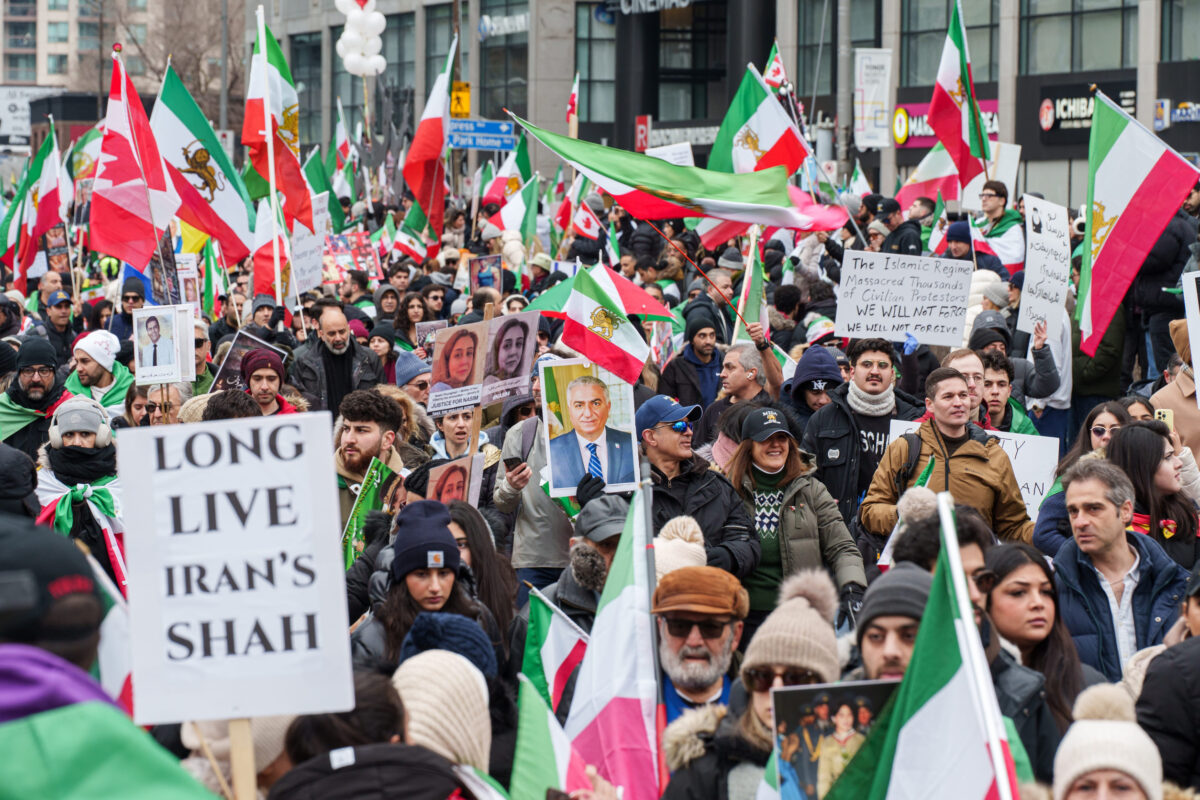 Toronto, Ontario - February 14, 2026: Iranian diaspora rally with flags and protest signs
