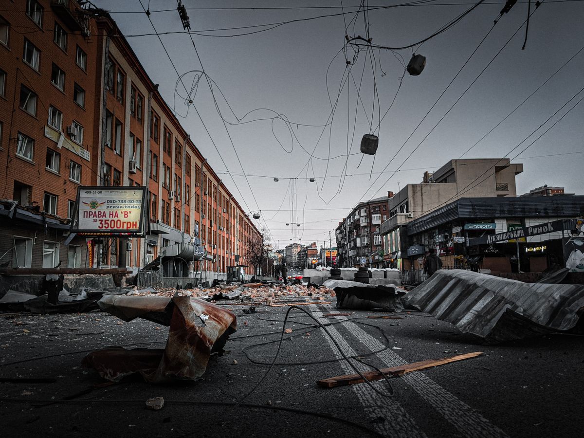 A city street in Kyiv is left in ruins, showcasing debris and destruction in an urban environment.