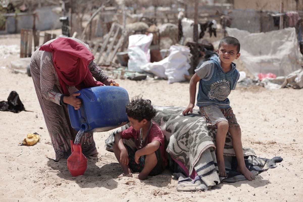Trump Announces Gaza Disarmament Deal With Hamas, But 3 Major Questions Could Decide Whether It Survives 2 A poignant scene of children in Gaza coping with difficult living conditions, highlighting resilience and survival.