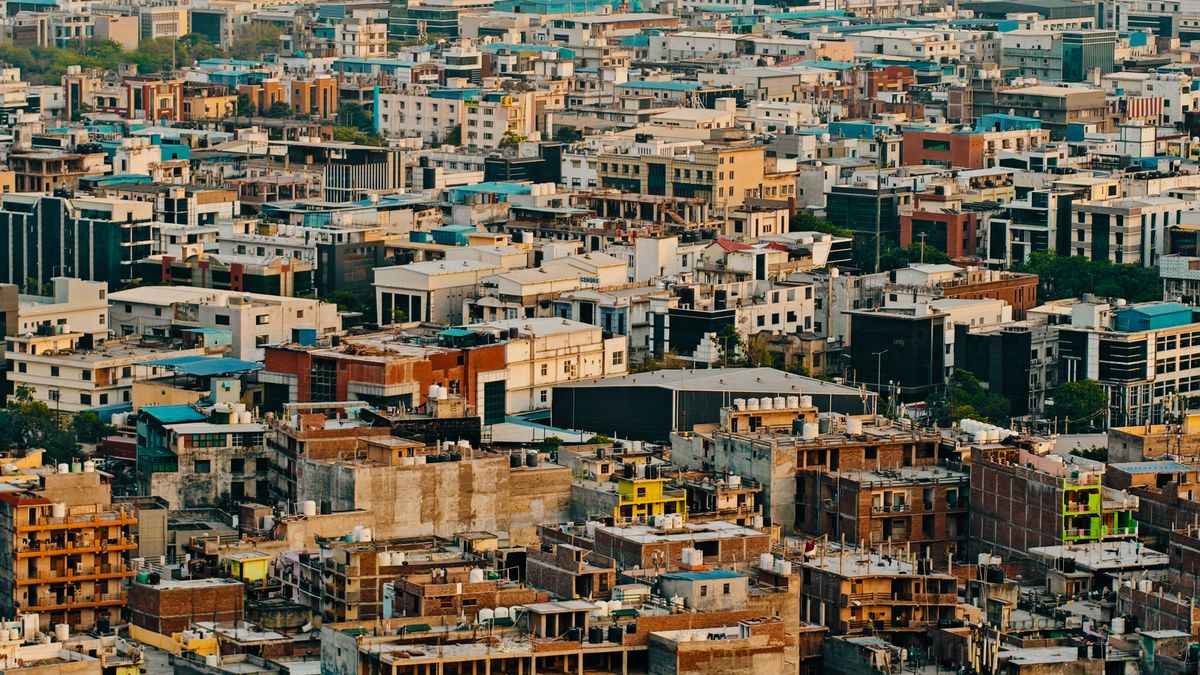 Urban League’s 2026 State of Black America Report Warns Trump Policies Are Pushing the American Dream Further Away 2 Aerial urban view showcasing densely packed residential and commercial buildings in an expansive cityscape.