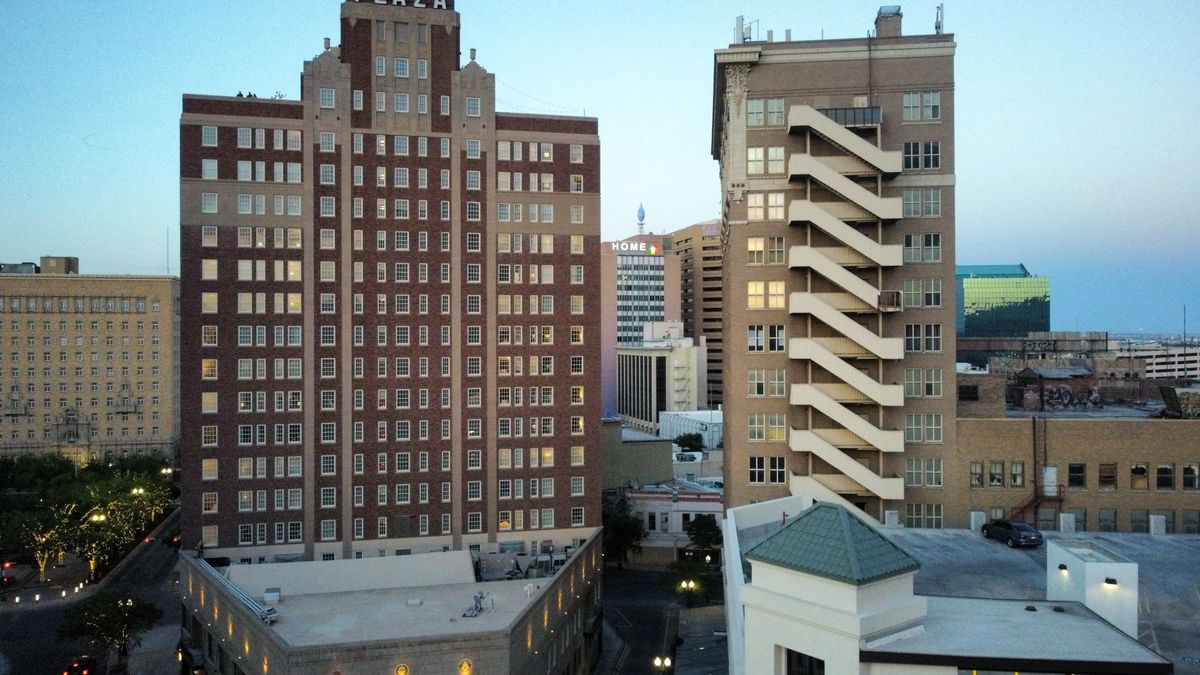 Texas Apartment Owners Are Facing a Perfect Storm as Billions in Real Estate Bets Begin to Crack 1 Aerial view of modern buildings in downtown El Paso at dusk.