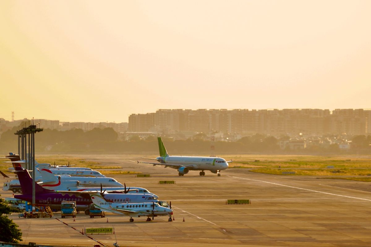 WestJet Strike Leaves Thousands in Limbo as Canada’s Air Travel System Faces a Major Test 1 Airplanes parked on a runway during sunrise, capturing a busy airport scene.