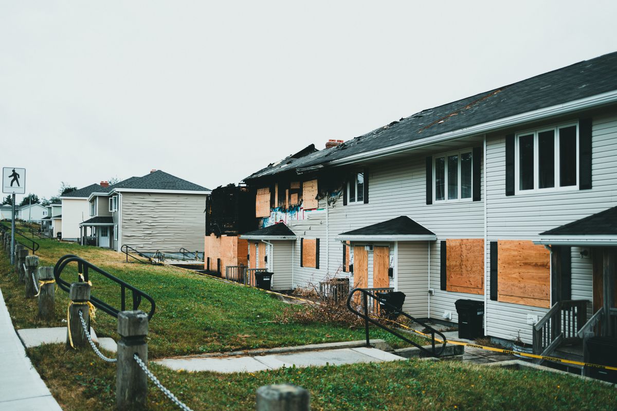 Britain’s millionaire exodus is a warning America cannot afford to ignore 2 Boarded-up suburban homes with visible fire damage and neglect.