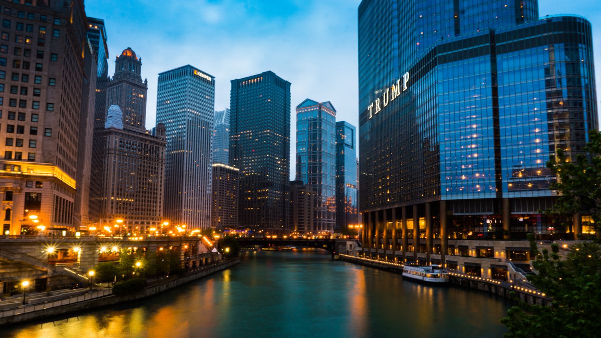 Trump’s Patriot Passport turns America’s travel document into a personal billboard. 1 Captivating cityscape of Chicago's skyline with the iconic Trump Tower at dusk, reflecting vibrant urban life.
