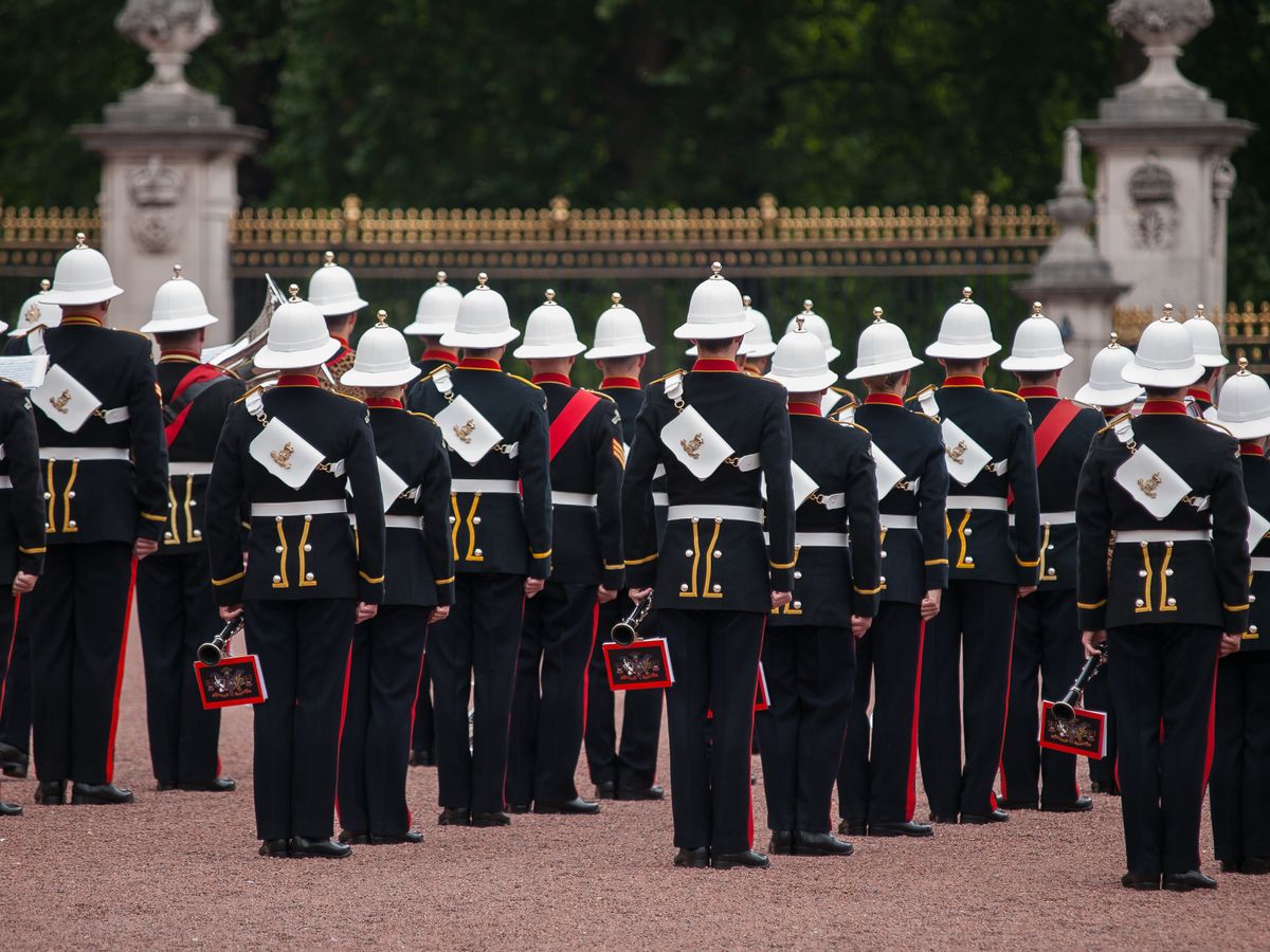 Ceremonial soldiers in traditional uniform back view at London's Buckingham Palace.