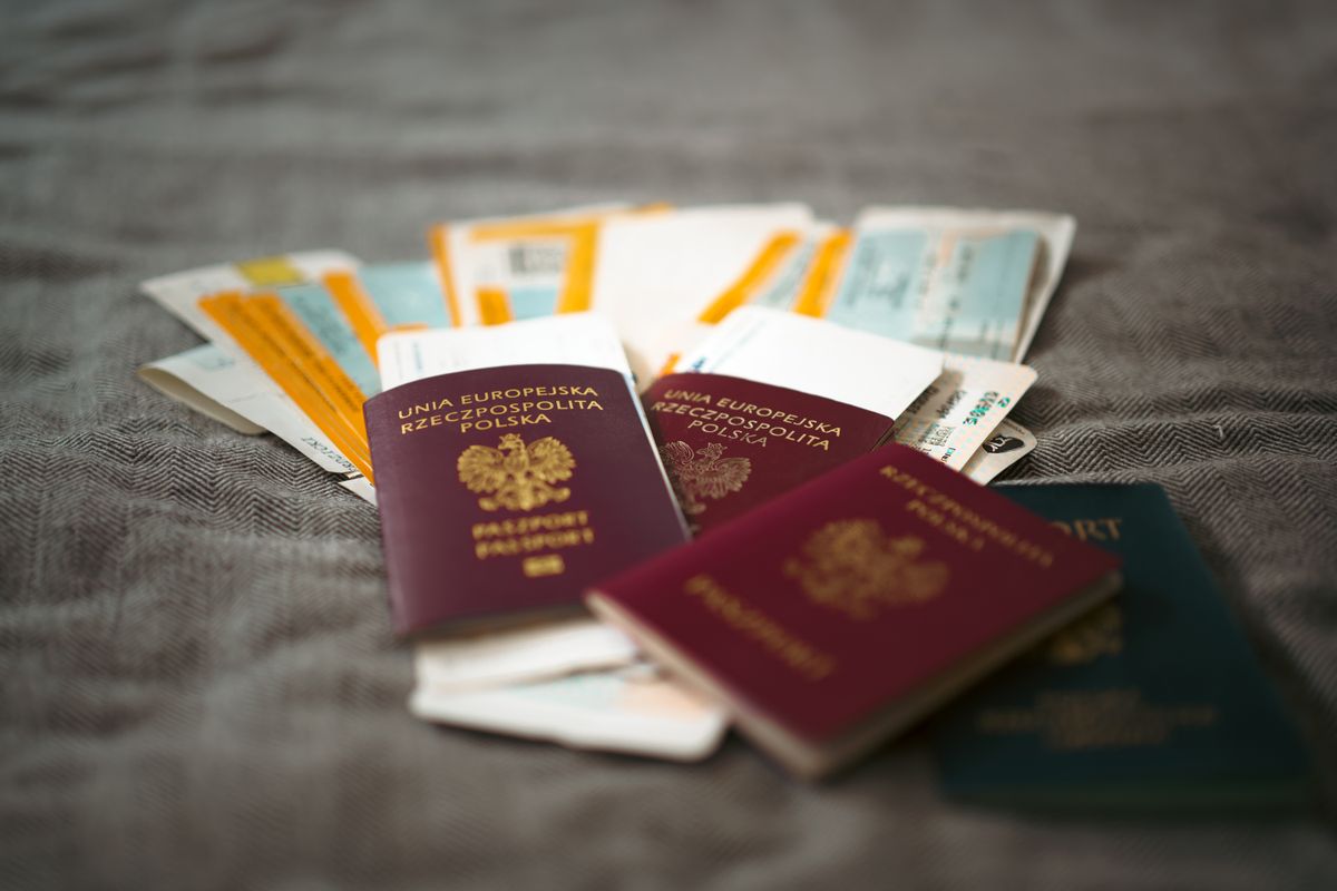 Chicago Citizenship Crisis Deepens as Naturalizations Plunge More Than 80%, Leaving Thousands Waiting to Become Americans 2 Close-up of Polish passports and travel tickets symbolizing travel and adventure.