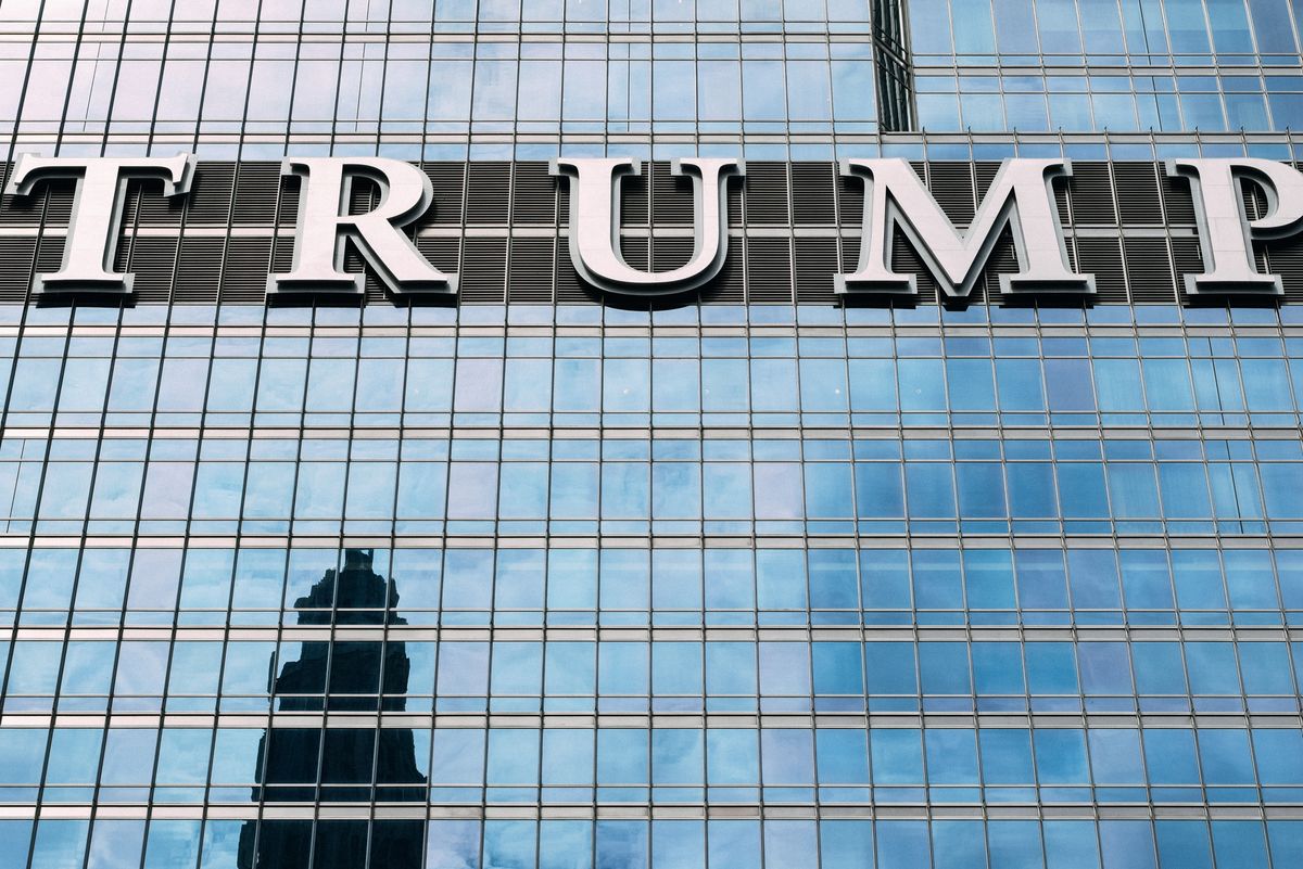 Trump’s Tariff Defense in Michigan Sparks New Fight Over America’s Auto Future: Jobs, Prices and the High Stakes Behind ‘America First’ 2 Close-up of Trump Tower's glass facade with the city skyline reflection in the windows.