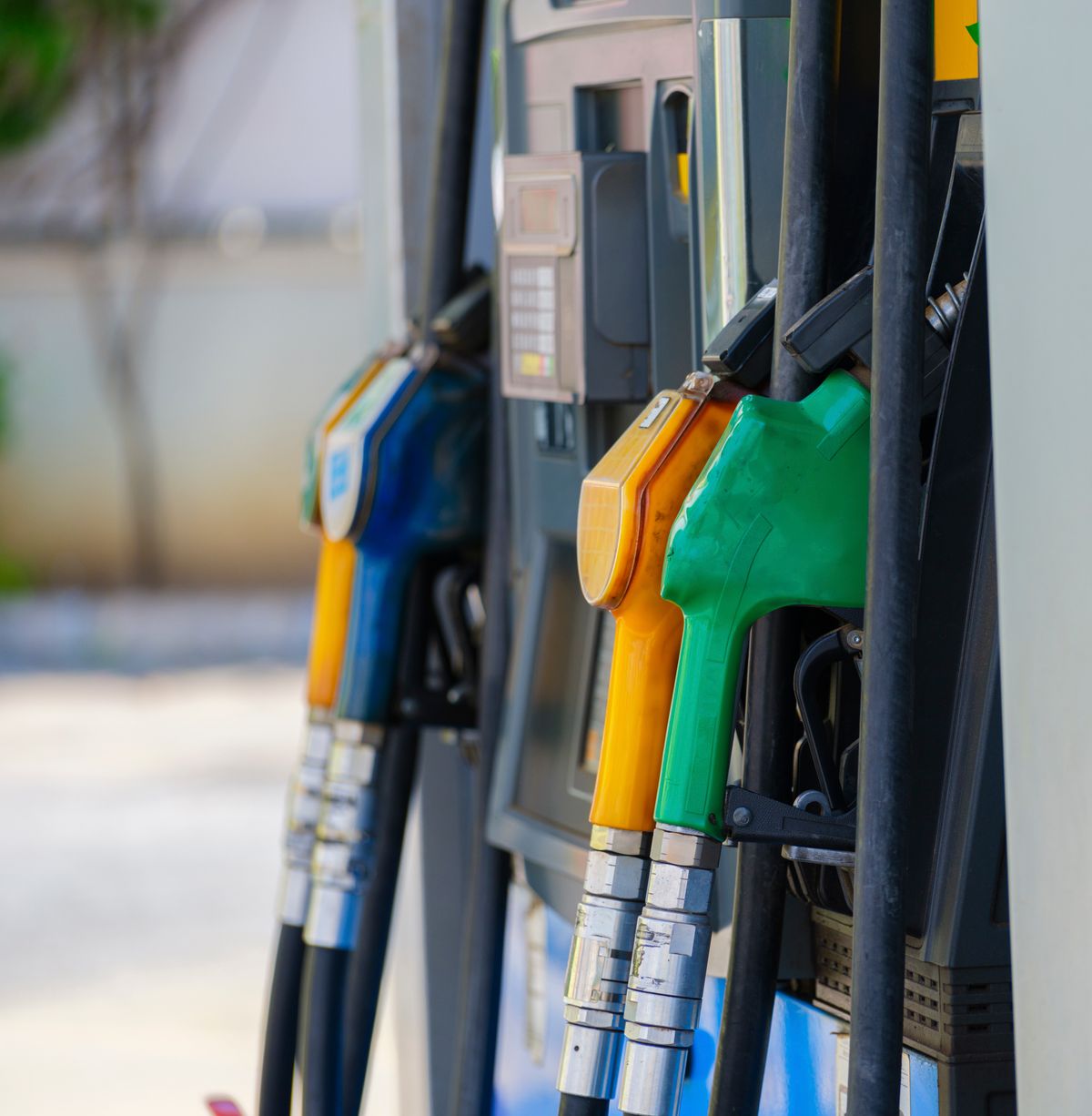 Scott Bessent’s Warning to Oil and Gas Companies Reveals America’s Fuel Price Gap 2 Close-up of vibrant fuel nozzles at a gasoline station showcasing diesel, gas, and petrol options.