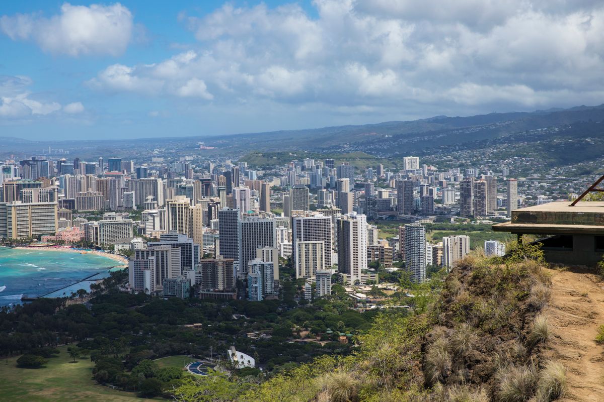 Americans Are Watching Their Paychecks Shrink: These States Take the Biggest Share of Residents’ Income in Taxes 1 Discover the stunning skyline of Honolulu with ocean views from a scenic overlook.