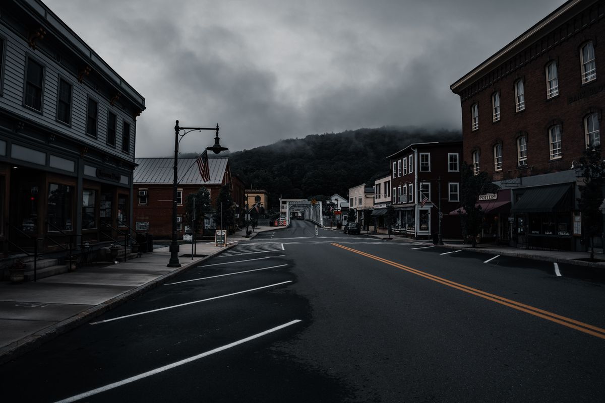 America’s Small Businesses Are Being Crushed by Costs, Credit and a Broken Support System 1 Empty town street with historic buildings and moody clouds. Perfect for travel or urban exploration themes.