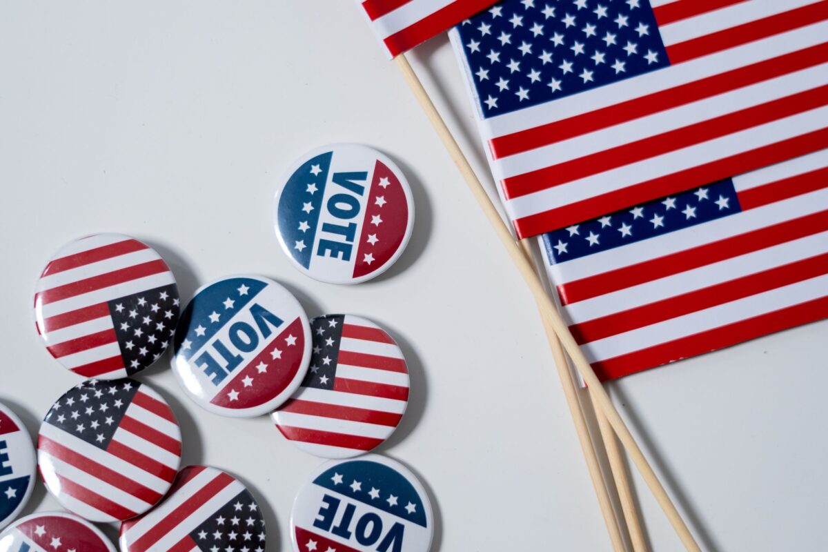american-flags-and-pins-on-white-background