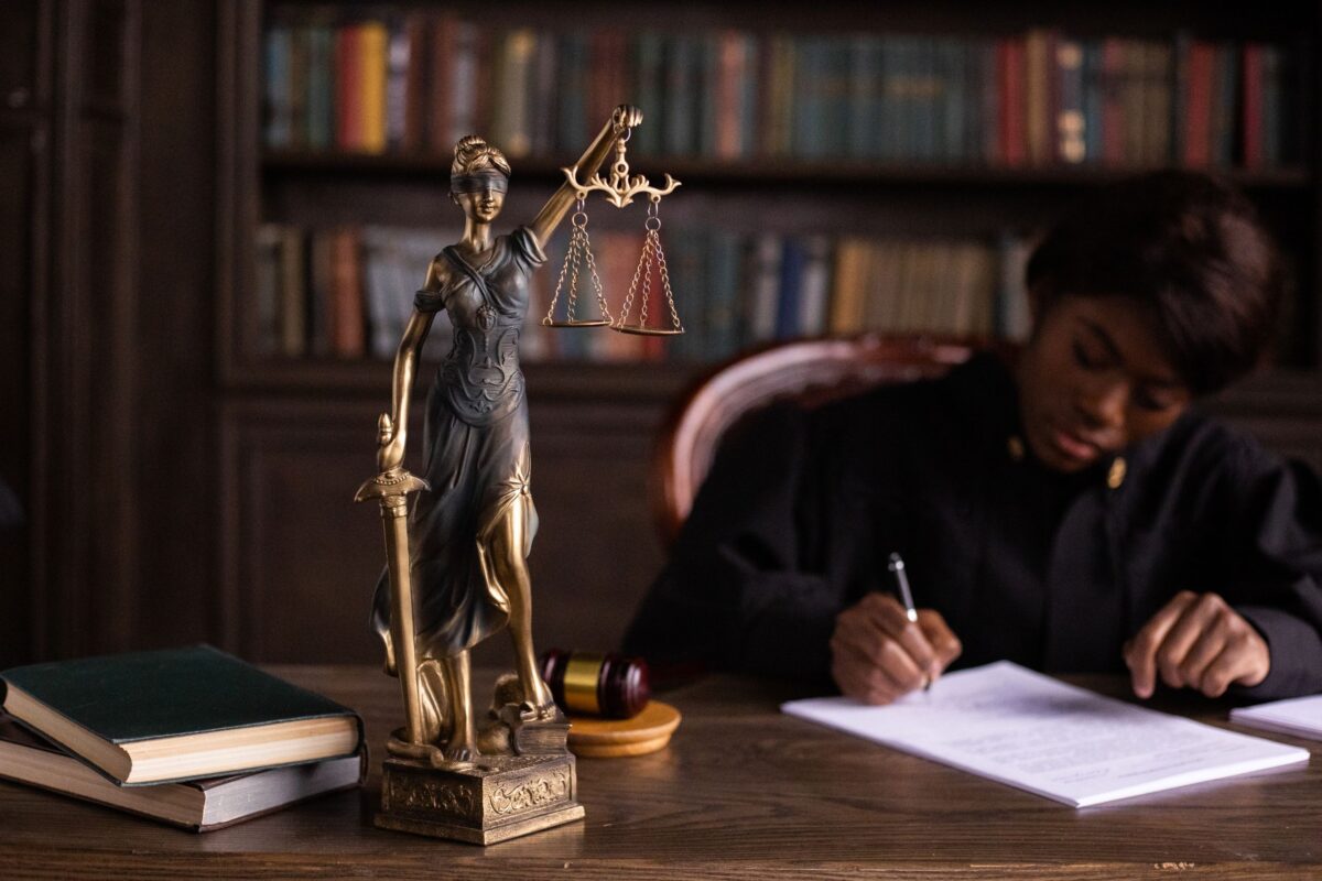 a-figurine-of-the-lady-justice-on-the-table-of-a-judge