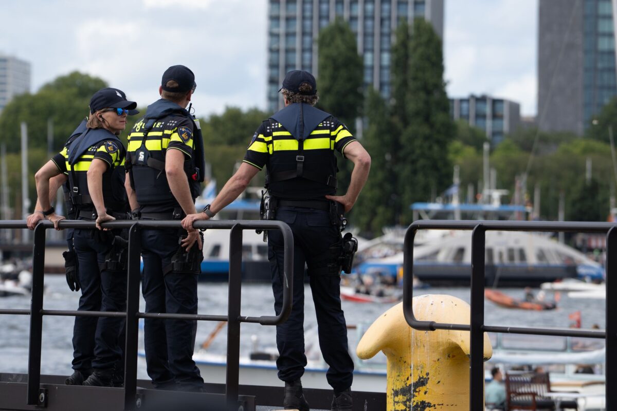 Sausalito's City Manager Elaine Forbes Arrested on a Yacht Just Three Weeks After Taking Over Top Job, Sending Shockwaves Through Local Government. 2 police-officers-overlooking-waterfront-scene