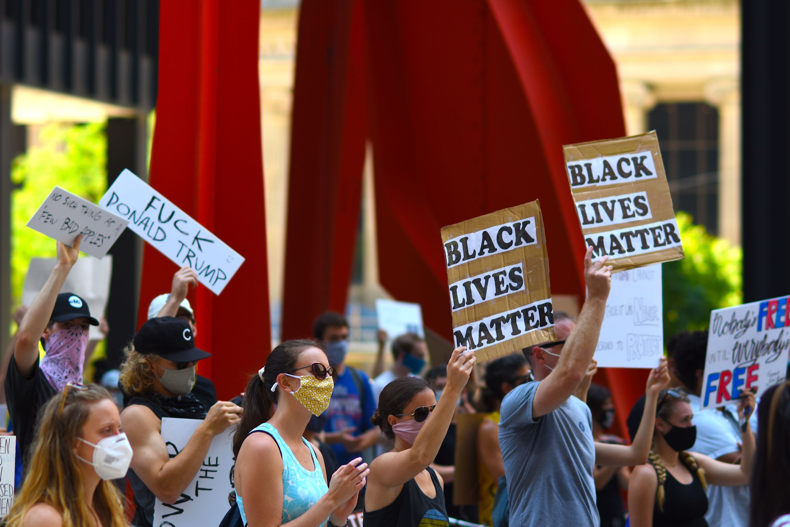 Taylor Swift Songs Disappear From Trump and White House Social Media Posts 2 Protesters gather with signs supporting Black Lives Matter and denouncing Donald Trump in a peaceful rally.