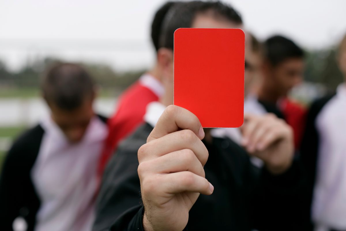 Trump’s FIFA Intervention Over Folarin Balogun Suspension Sparks World Cup Controversy: “One Call” Turns Soccer Decision Into Global Debate 1 Referee showing a red card to players during an outdoor soccer game.