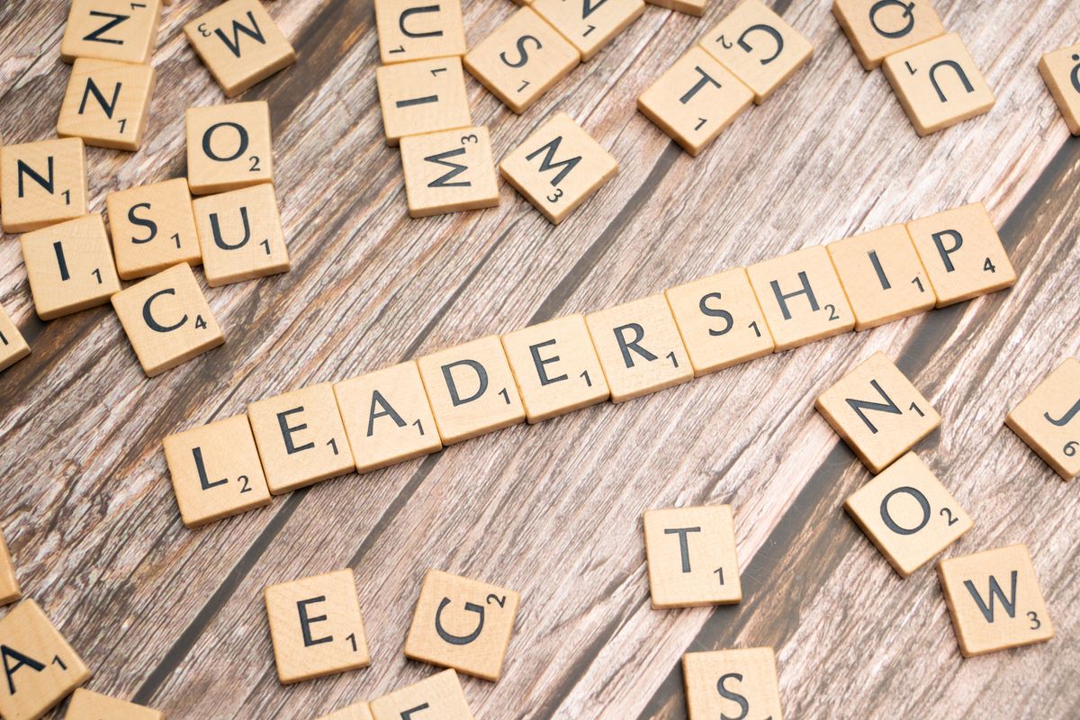 DNC Crisis Deepens as Ken Martin Faces Phone Incident Report, $18.5 Million Debt and Midterm Pressure 2 Wooden letter tiles spelling 'LEADERSHIP' on a wooden surface, symbolizing leadership qualities and skills.