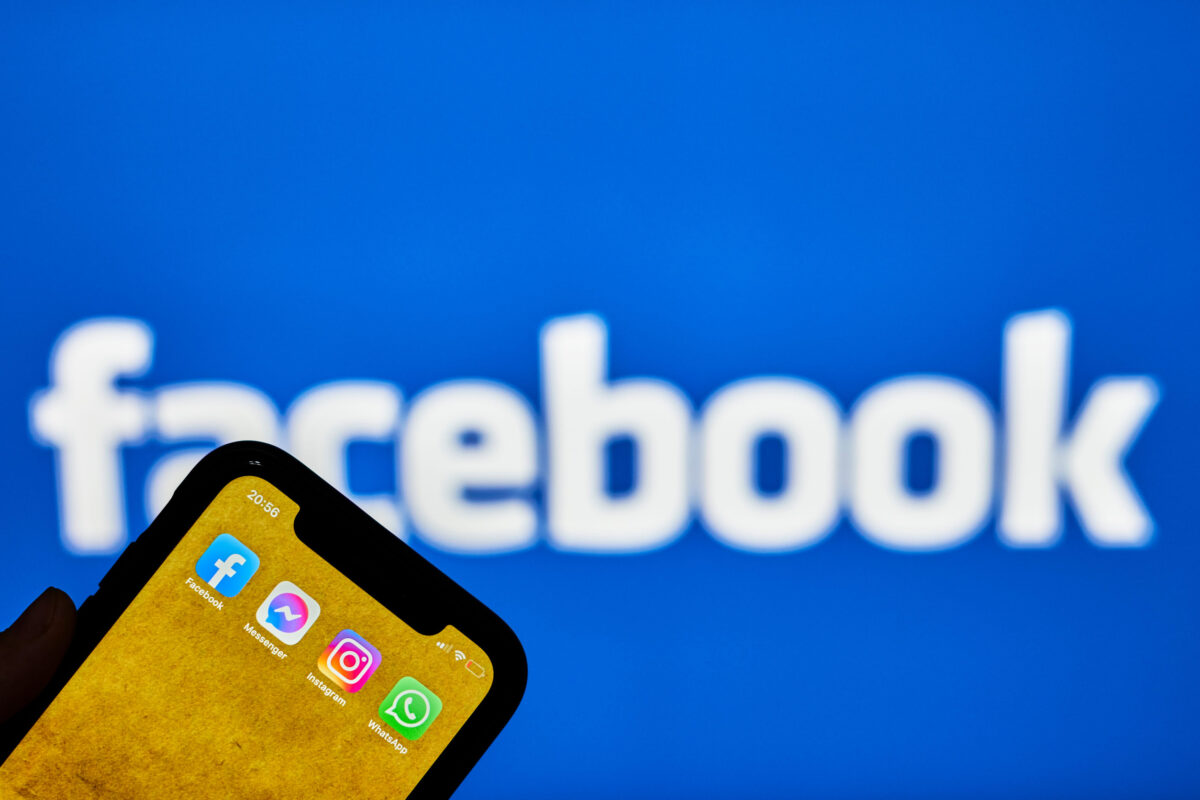 Meta Ordered to Pay Another $567 Million in Child Safety Case, Bringing Total to $942 Million 2 Tashkent, Uzbekistan - 22 October, 2021: Hand holds mobile phone with Facebook company applications on phone display and Facebook logo