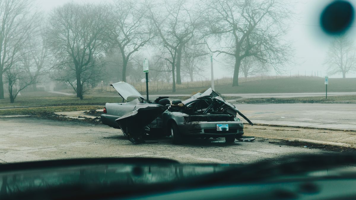 13-Year-Old Accused of Driving Stolen Kia in Maryland Crash That Killed Virginia Father and Injured 7 Teens 1 A foggy morning with a severely damaged car on a deserted street in Chicago.