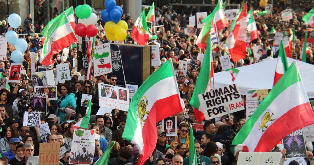 a peaceful protest in vancouver advocating for human rights in iran featuring vibrant flags and diverse participants. 14136859 1200x630 1