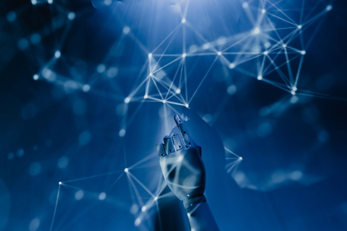 Cyberattacks Hit Water Systems in 12 States as Hidden Risks Surface 1 A robotic hand reaching into a digital network on a blue background, symbolizing AI technology.