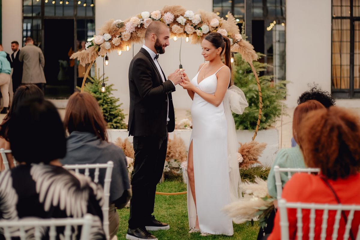 Can Marriage Get You a U.S. Green Card? The Requirements Couples Must Meet 1 Bride and groom exchange vows in a picturesque outdoor setting. Perfect moment captured.