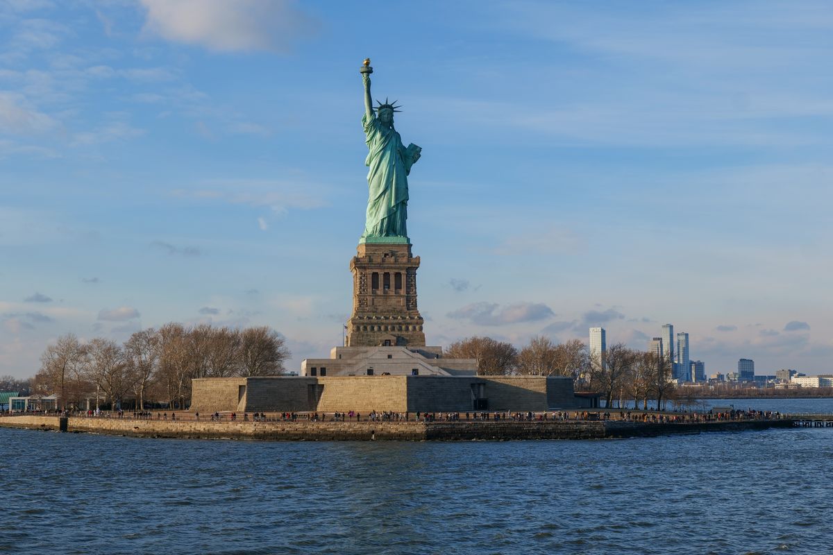 Statue of Liberty Boat Tragedy Leaves 2 Dead as Captain Faces 13 Charges 1 Capture of the Statue of Liberty with the New York City skyline in the background.