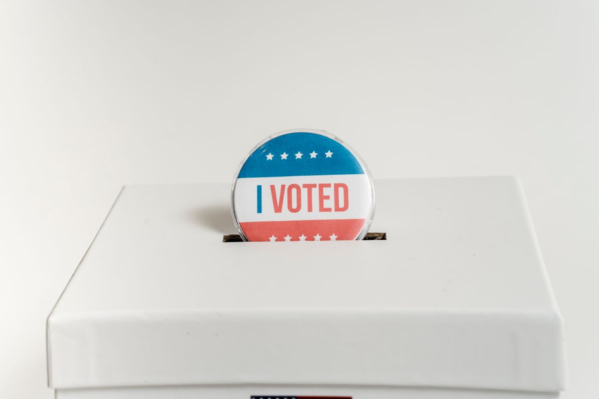 Maryland Republicans Launch Legal Challenge Over Redistricting Vote That Could Reshape Elections 1 Close-up of an I Voted badge on a ballot box, symbolizing voting in the USA elections.