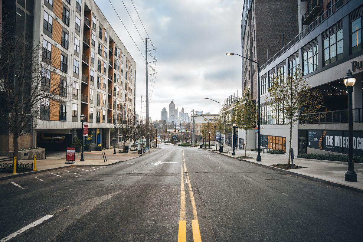 Urban street with view of downtown Atlanta skyline, capturing city's architectural charm.