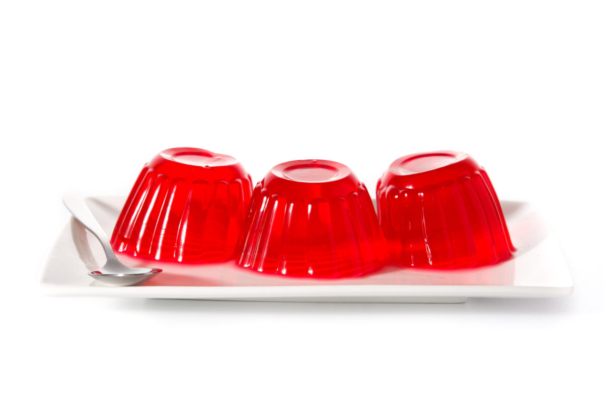 12 Vintage Foods That Time Forgot—But Grandma Didn’t 3 Strawberry jellies on a plate isolated on white background