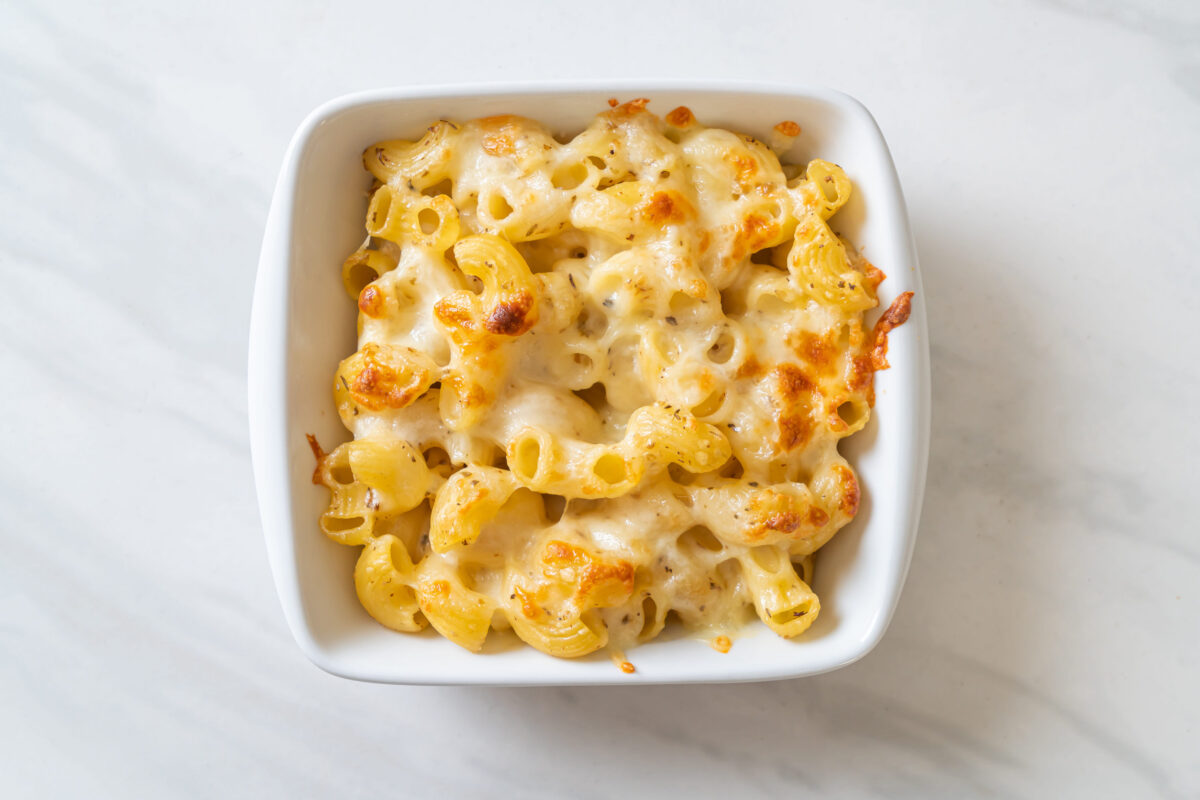 mac and cheese, macaroni pasta in cheesy sauce - American style