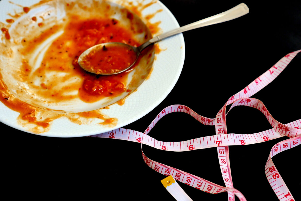 eating a lot and gaining weight, finished dinner plate and tape measure,