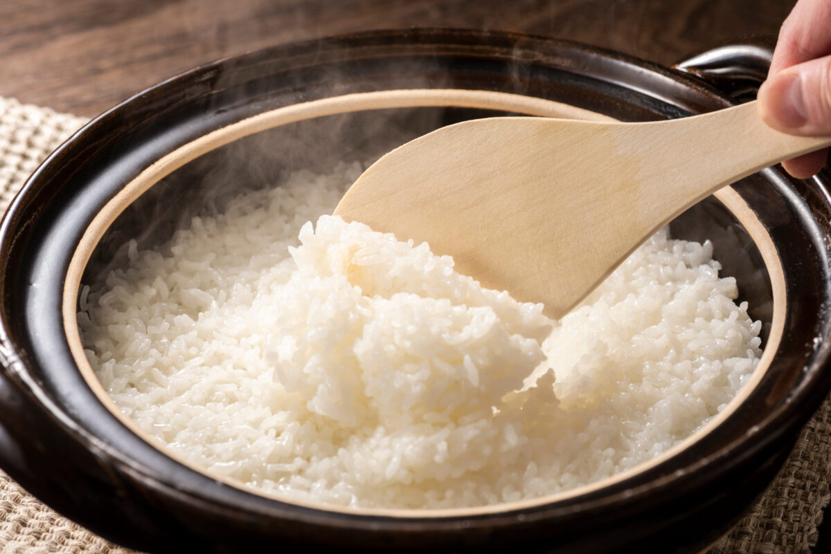 Cooking rice in a Japanese pot, a traditional recipe.