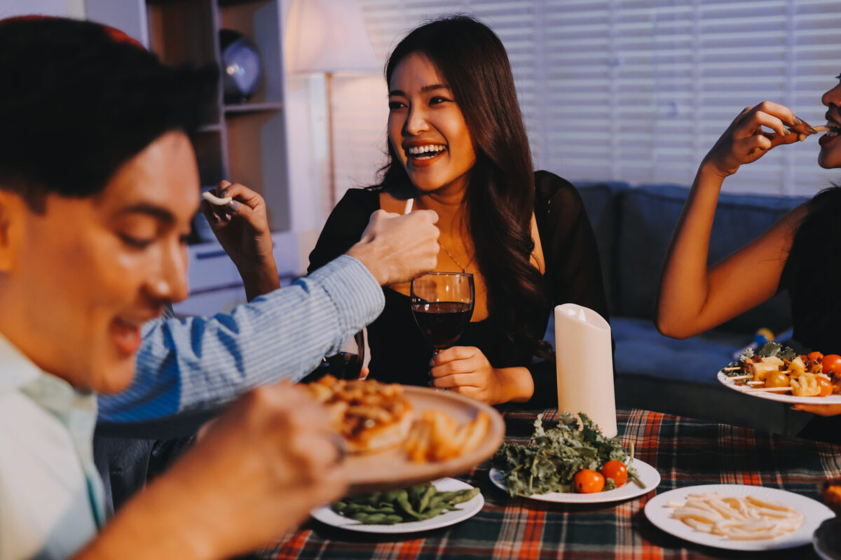 Diversity, dinner and group of people toast celebration together at party. Friends, happy and celebrate with food, wine and friendship for love, support and cheers champagne at business function