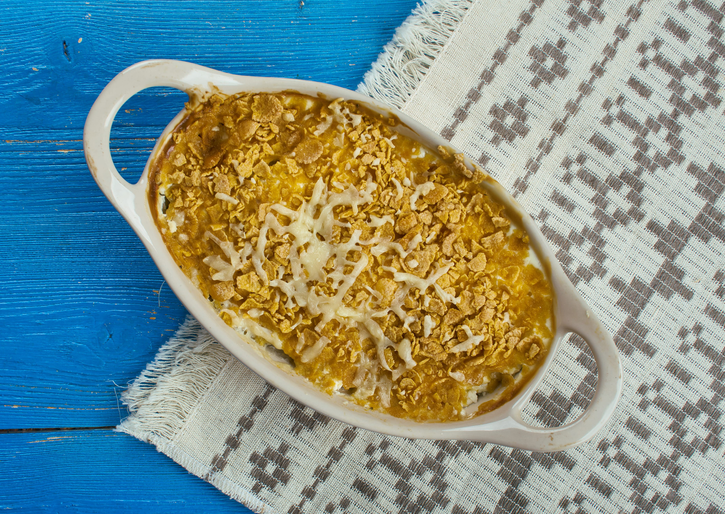Cod Au Gratin - appetizer from New Foundland, Canada, Flaked cod is layered with white sauce, and sprinkled with Cheddar cheese before being baked in this simple casserole.