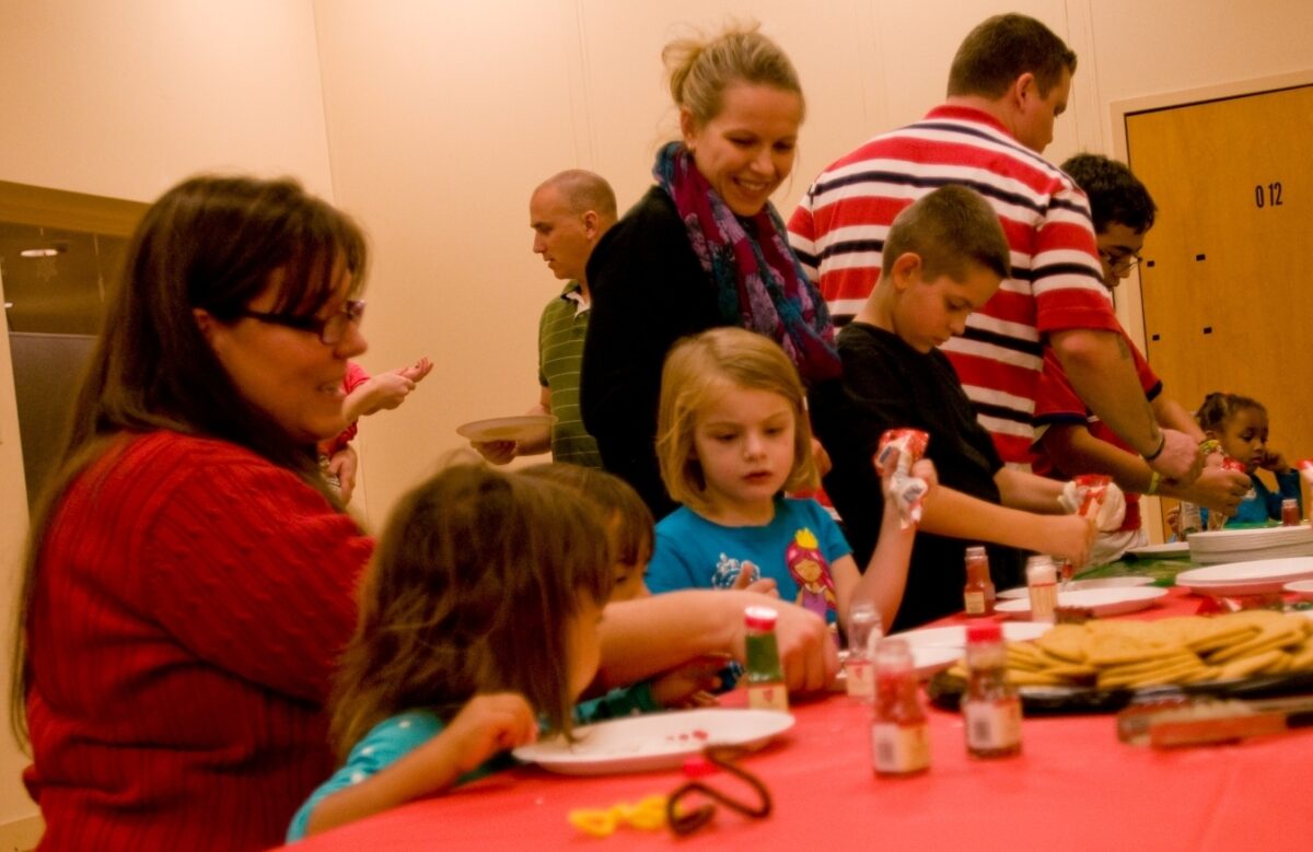 Attendees decorate cookies at the Exceptional Family Member Program’s holiday party held at the main Army Community Service building on Fort Bliss, Texas, Dec. 4, 2014. The party gave children a chance to let loose and have fun. (U.S. Army photo by Sgt. Jarred Woods, 16th Mobile Public Affairs Detachment)
