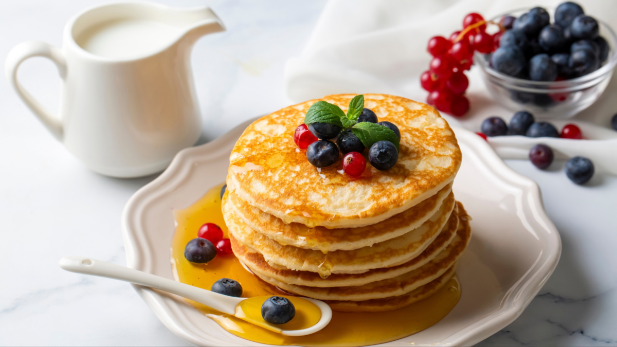 The Breakfast Debate That Never Gets Old: Waffles or Pancakes? 1 homemade classic american pancakes with fresh fruit and honey