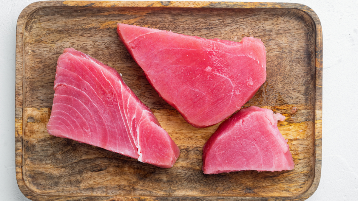 Raw organic tuna fillet. Seafood set, on wooden tray