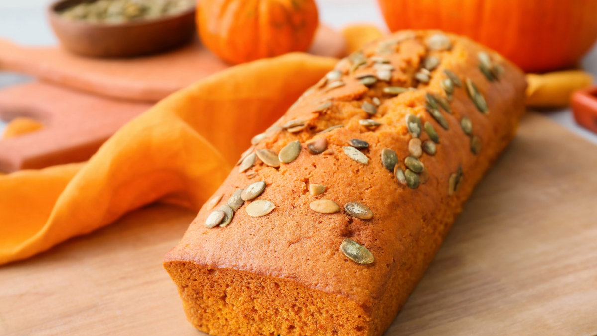 7 Fall Bake Ideas That Will Make Your Kitchen Smell Like Autumn 1 A delightful loaf of pumpkin bread, generously topped with crunchy pumpkin seeds