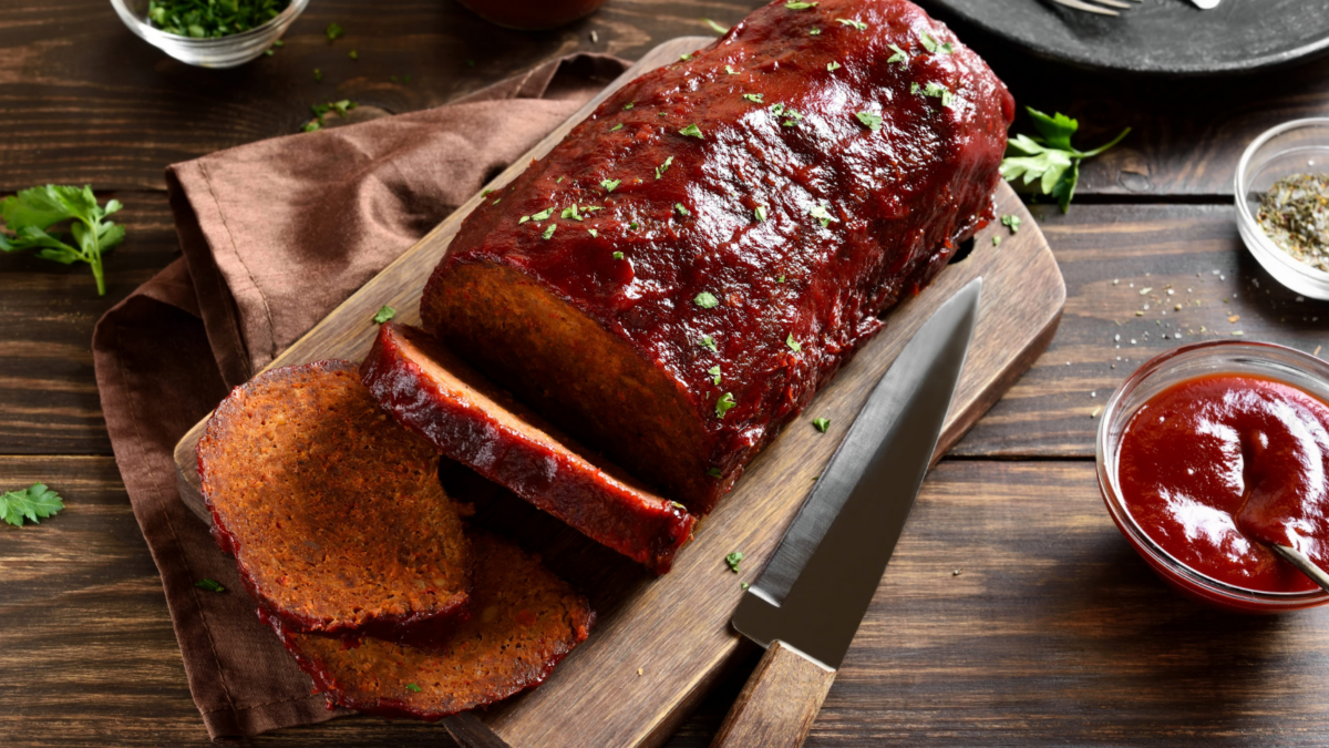 A succulent meatloaf drizzled with rich barbecue sauce